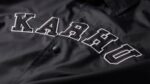 Karhu NZ Black Worldwide Coach Jacket - Image 2